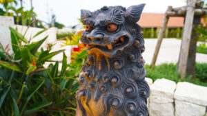clay traditional japanese mythical shisa statue at sunset Okinawa Japan